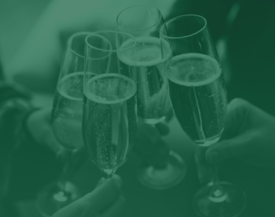 Green tinted image of a group cheers with champagne flutes 