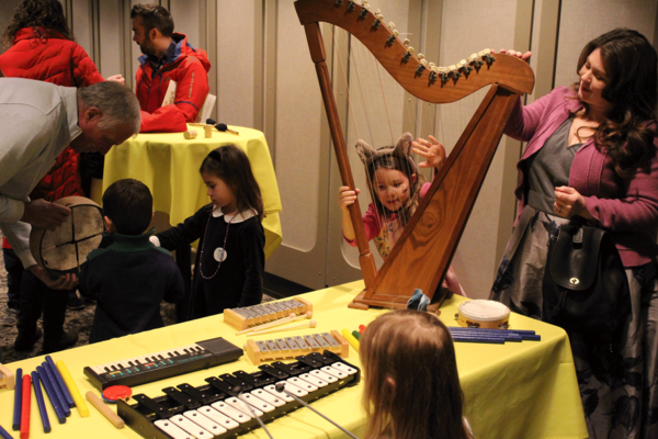 A group of young children playing with a range of instruments